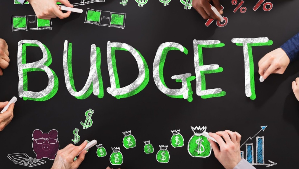 People Drawing Budget Finance Concept On Blackboard